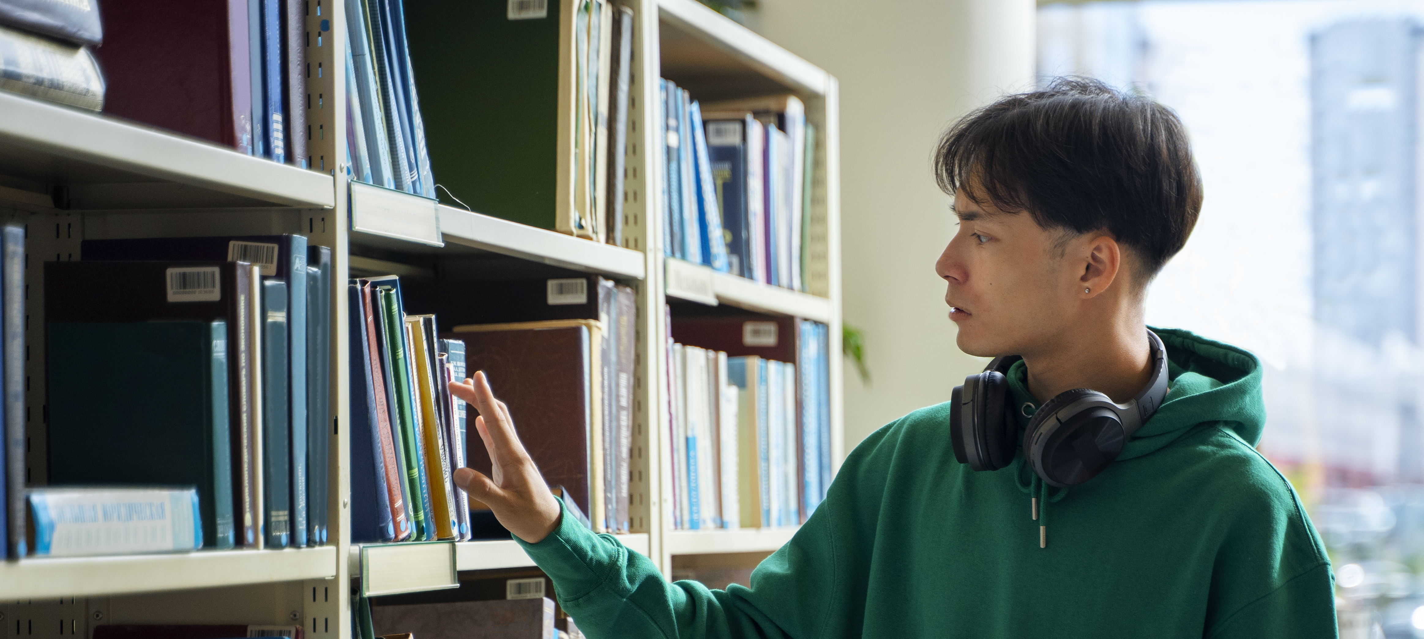 student looking at books