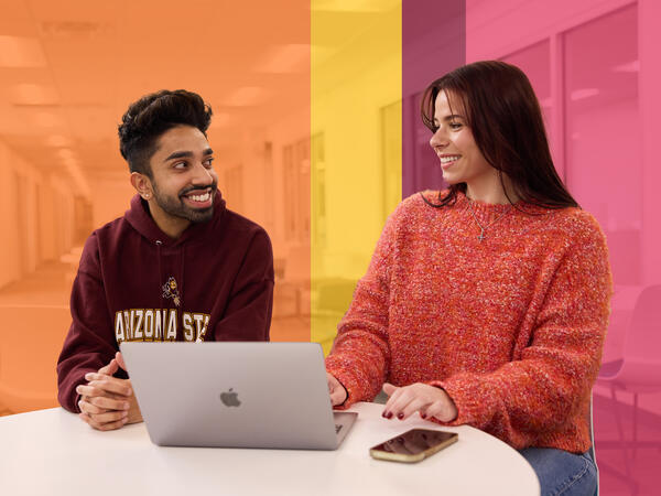 Two students smiling