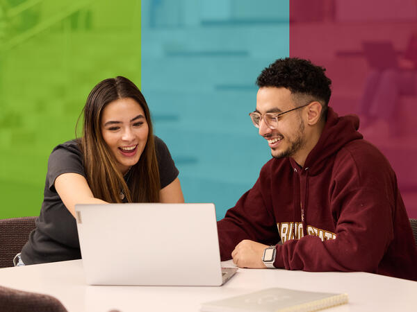 Two students working on a computer
